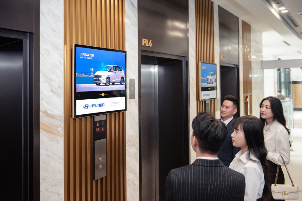 Chicilon Media's advertising screens in the elevator lobby of a high-class building